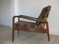 A solid teak armchair by Greaves & Thomas