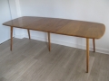 A solid elm ercol extending dining table 