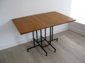 A Ladderax teak/metal drop-leaf table