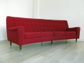 A Danish curved 4 seater sofa