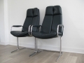 A pair of leather 'eleganza' carver chairs by Pieff