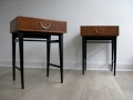 A pair of 1970s bedside tables with ebonised legs