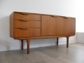 A compact teak sideboard by A.H. McIntosh and Co