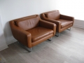 A pair of tan leather 'aspen' chairs by Terence Conran