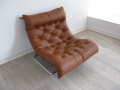 A 1970s tan leather and tubular chrome lounge chair