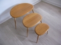 A set of pebble tables by Ercol